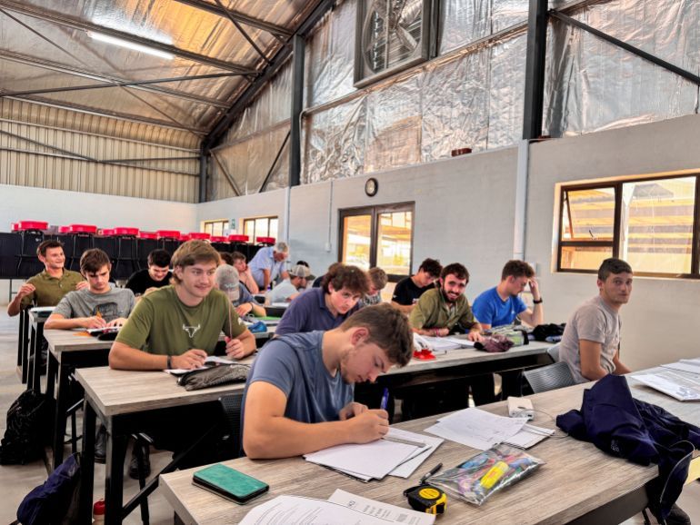 Students of Orania town's Bo Karoo Opleiding (BKO) school, sit in their classroom in whites-only town of Orania, South Africa, March 31, 2025. REUTERS/Sisipho Skweyiya