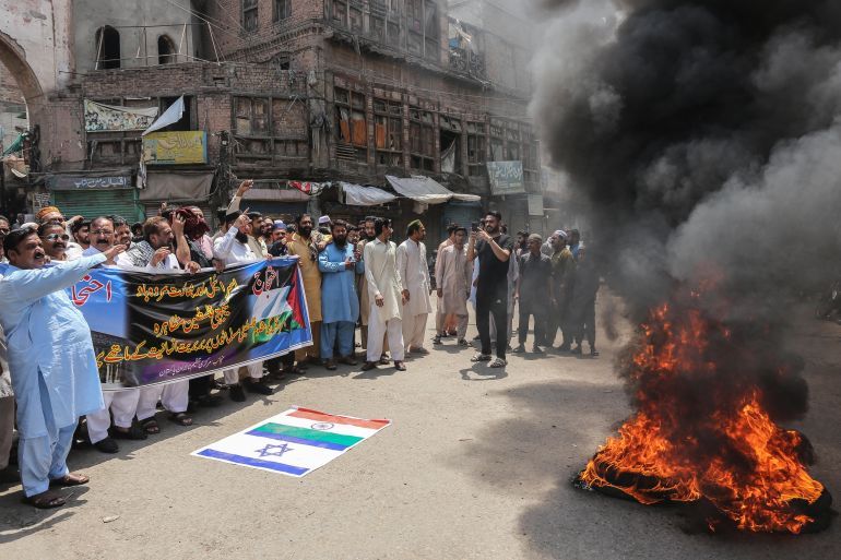 Pakistani traders shout slogans during a nationwide strike called by the Jamaat-e-Islami (JI) party in Multan on April 26, 2025, to protest against the Israeli strike on Gaza and India's measures against Pakistan over the recent Kashmir attack. (Photo by Shahid Saeed MIRZA / AFP)