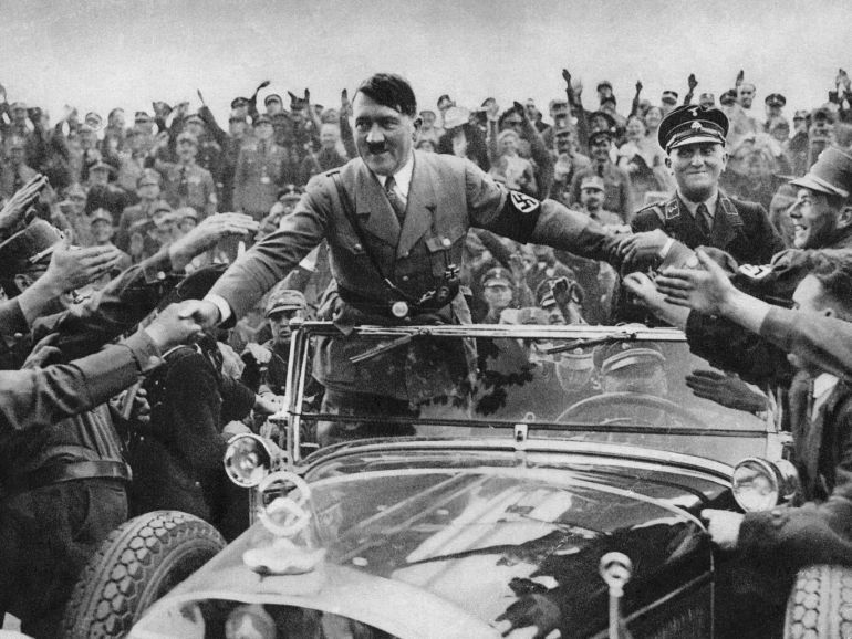 1933: Adolf Hitler (1889 - 1945), chancellor of Germany, is welcomed by supporters at Nuremberg. (Photo by Hulton Archive/Getty Images)