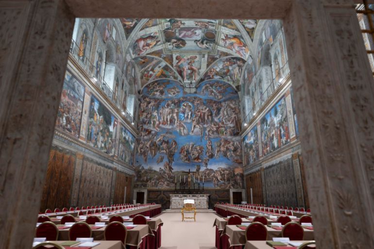 TOPSHOT - This photo taken and handout on May 6, 2025 by The Vatican Media shows the Sistine Chapel on the eve of the conclave in The Vatican. (Photo by Handout / VATICAN MEDIA / AFP) / RESTRICTED TO EDITORIAL USE - MANDATORY CREDIT