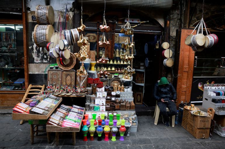 A man sits at a traditional souq in the Bab Touma district of the Old City of Damascus, after the ousting of Syria's Bashar al-Assad, in Damascus, Syria, December 22, 2024. REUTERS/Ammar Awad