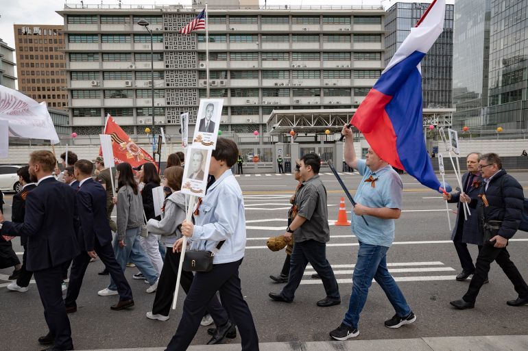 Over 200 members of the Coordinating Council of Russian Compatriot Organizations and other Russian residents in South Korea march in a Victory Day parade in front of the U.S. Embassy in Seoul, South Korea, on May 6, 2025. (Photo by Chris Jung/NurPhoto via Getty Images)