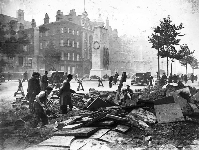 الموسوعة / صورة من الحرب العالمية الثانية - 18th October 1940: A crater in the pavement near the Cenotaph in Whitehall made by a bomb during a night raid. (Photo by Central Press/Getty Images)