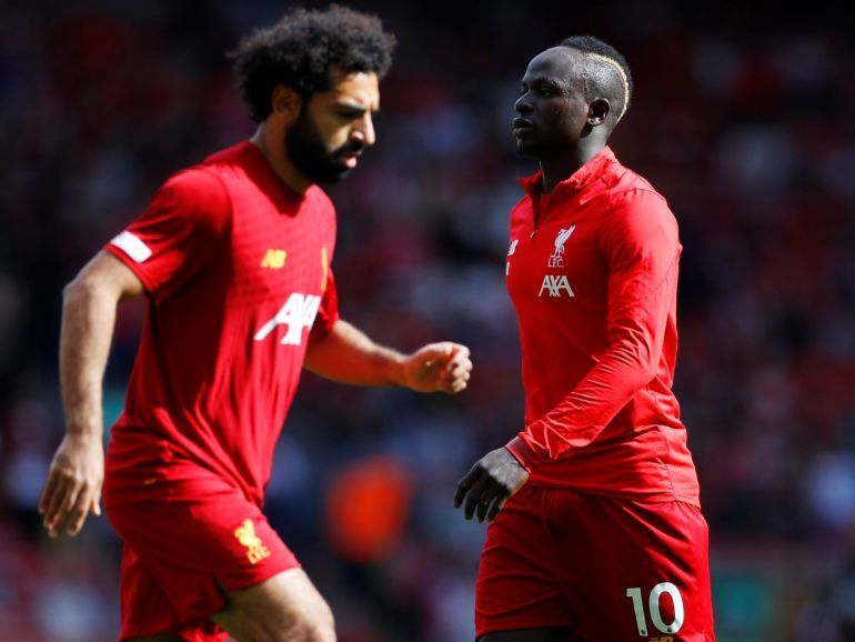 Soccer Football - Premier League - Liverpool v Newcastle United - Anfield, Liverpool, Britain - September 14, 2019 Liverpool's Sadio Mane and Mohamed Salah during the warm up before the match REUTERS/Phil Noble EDITORIAL USE ONLY. No use with unauthorized audio, video, data, fixture lists, club/league logos or