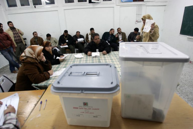 JABALYA, GAZA STRIP - JANUARY 25: Palestinian local observers start to count votes inside a polling station in Gaza Strip January 25, 2006. The newly elected Palestinian Legislative Council (PLC) will be expanded, and half of the seats will be allotted by proportional representation of all parties that gather more than two percent of the vote. (Photo by Abid Katib/Getty Images)