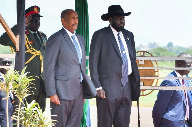Sudan's Sovereign Council Chief General Abdel Fattah al-Burhan stands with South Sudanese President Salva Kiir upon arriving at the Juba International Airport, in Juba, South Sudan September 16, 2024. REUTERS/Jok Solomun