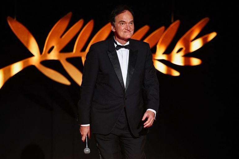 Quentin Tarantino delivers arrives on stage to open the festival during the opening ceremony and the screening the film