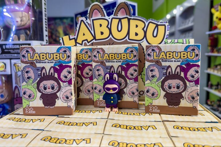 Guayaquil, Ecuador - April 17, 2025: Labubu vinyl figure displayed with surprise blind boxes in a store in Guayaquil, Ecuador. Product from The Monsters series by Pop Mart in editorial context.