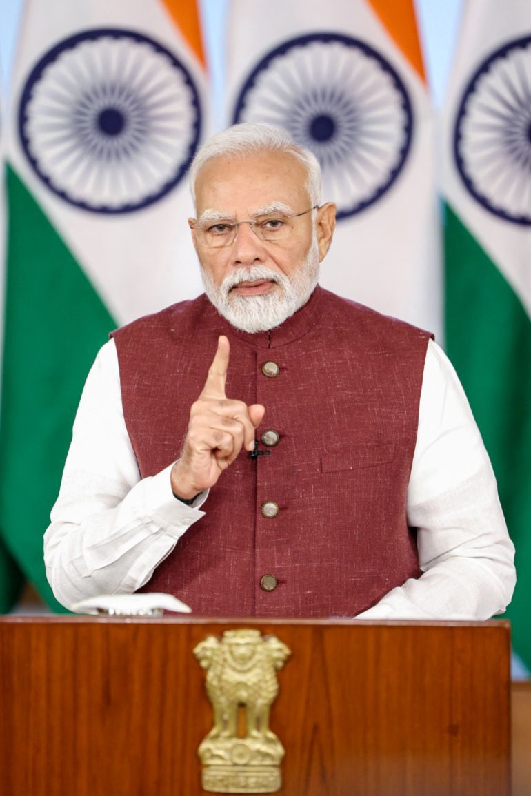 This handout photograph released on May 12, 2025, by the Indian Press Information Bureau (PIB) shows India's Prime Minister Narendra Modi addressing the nation following a truce with Pakistan, via video conferencing in New Delhi.
