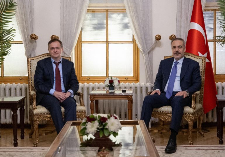 This handout photograph taken and released by Turkish Foreign Ministry press service on May 15, 2025, shows Turkish Foreign Minister Hakan Fidan (R) with Russia's delegation head Vladimir Medinsky (L) at the Dolmabahce Palace in Istanbul.