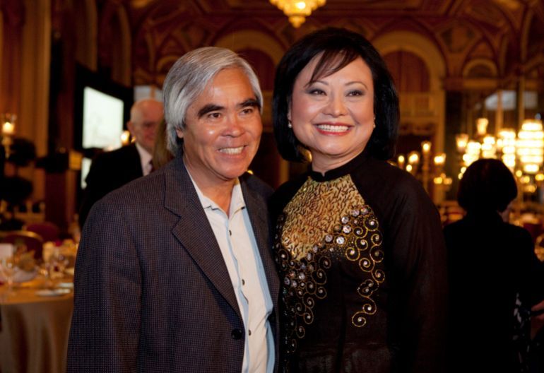 Photojournalist Nick Ut and Kim Phuc Phan Thi pose for pictures at the