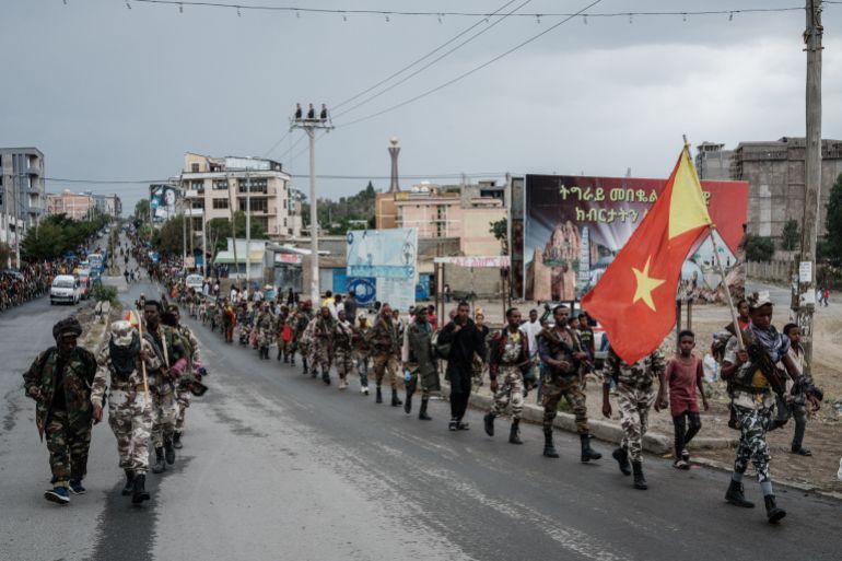 Tigray People's Liberation Front (TPLF) fighters walk in lines towards another field in Mekele, the capital of Tigray region, Ethiopia, on June 30, 2021. Rebel fighters in Ethiopia's war-hit Tigray seized control of more territory on June 29, 2021, one day after retaking the local capital and vowing to drive all