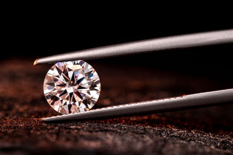 Round Cut Diamond in Tweezers