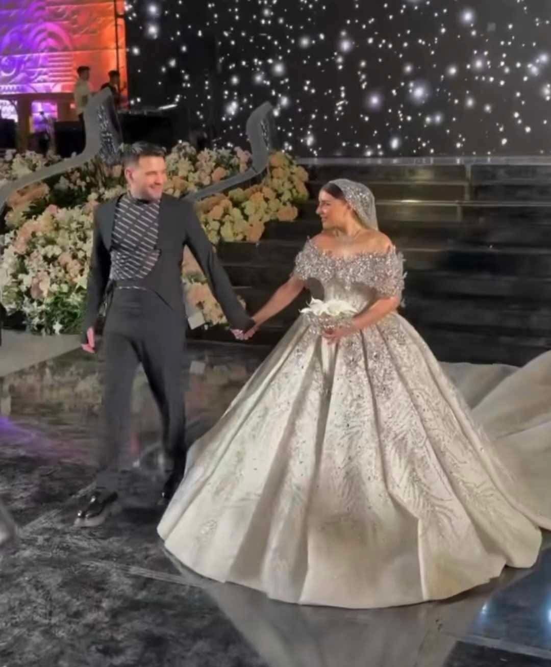 May be an image of 2 people, dais and wedding