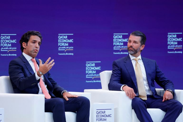 Donald Trump Jr. (R) and US Business executive Omeed Malik talk during a session in the Qatar Economic Forum in Doha on May 21, 2025. (Photo by Karim JAAFAR / AFP)