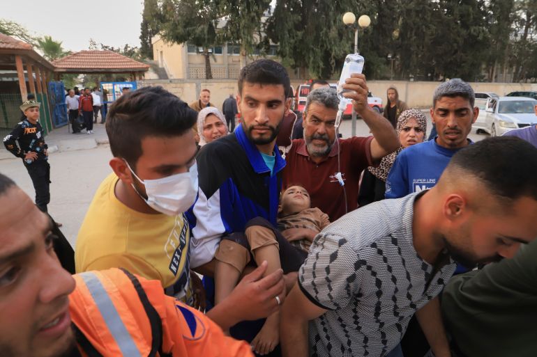Palestinians evacuate patients from the European hospital in Khan Younis, Gaza, after it was hit by an Israeli army airstrike, Tuesday, May 13, 2025. The Israeli military said it had carried out a strike targeting what it said was a Hamas