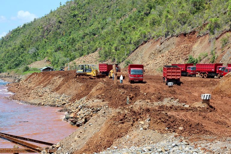 Sulawesi Tenggara - indonesia, October 17, 2011 : atmosphere in a nickel mine, trucks and excavators being used to transport nickel ore. Mine in Kolaka, Southeast Sulawesi