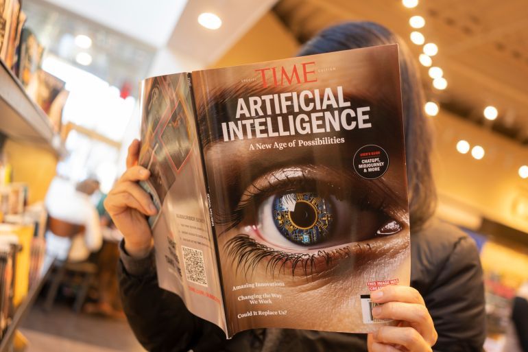 Tigard, OR, USA - Dec 12, 2023: A woman browses a TIME magazine special edition on