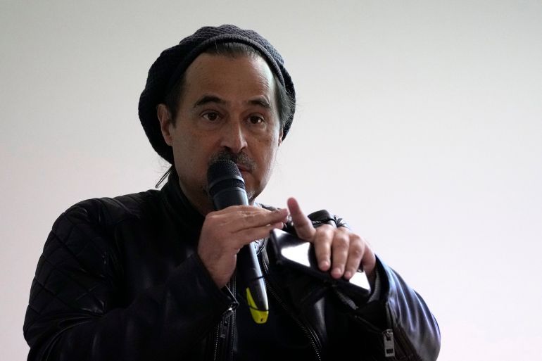Angolan writer Jose Eduardo Agualusa speaks during the presentation of a book by his friend Mozambican writer Mia Couto in Lisbon, Thursday, Nov. 4, 2021. (AP Photo/Armando Franca)