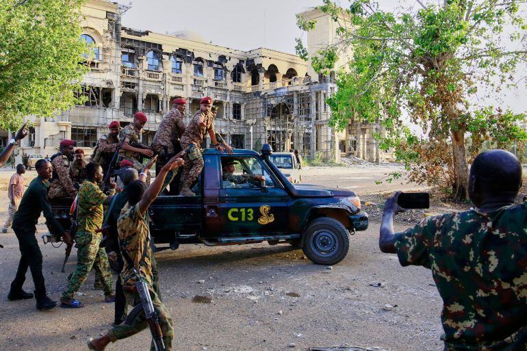 Sudan's Amy troops deploy for the arrival of military chief Gen. Abdel-Fattah Burhan at the Republican Palace, recently recaptured from the Rapid Support Forces paramilitary group, in Khartoum, Sudan, Wednesday, March 26, 2025. (AP Photo)