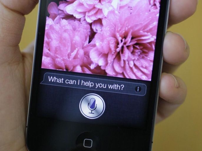 FILE - In this Monday Oct. 10, 2011, file photo, Siri, Apple's virtual assistant, is displayed on the Apple iPhone 4S in San Francisco. According to a three-month AP investigation released in January 2013, five years after the start of the Great Recession, instead of relying on someone else in the workplace or their personal lives, people are using technology to do tasks independently. (AP Photo/Eric Risberg, File)
