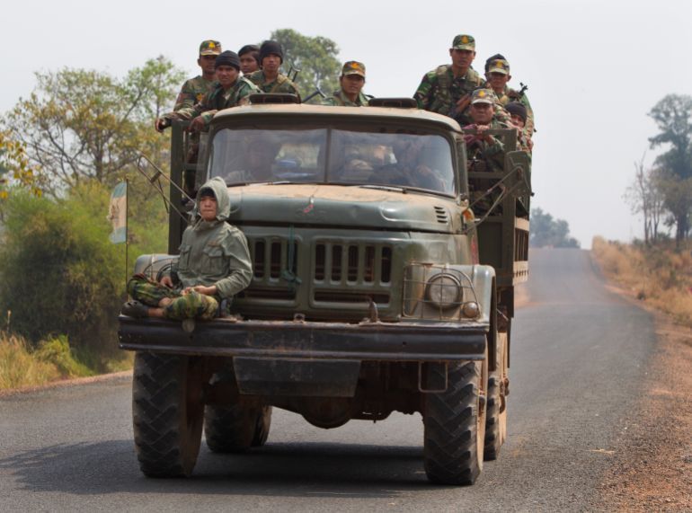 PREAH VIHEAR, CAMBODIA - FEBRUARY 8: Cambodian soliders head towards the 11th-century Preah Vihear temple as tensions remain high on both sides of the border, on February 8, 2011 in Preah Vihear, Cambodia. Thousands of refugees have fled the area after clashes between Thai and Cambodian troops near the disputed World Heritage site. Presently there is no official ceasefire in place as the two countries contest ownership of the 4.6 sq-km area. The 900-year-old temple belongs to Cambodia following a 1962 World Court ruling but this remains disputed by many Thais. (Photo by Paula Bronstein/ Getty Images)