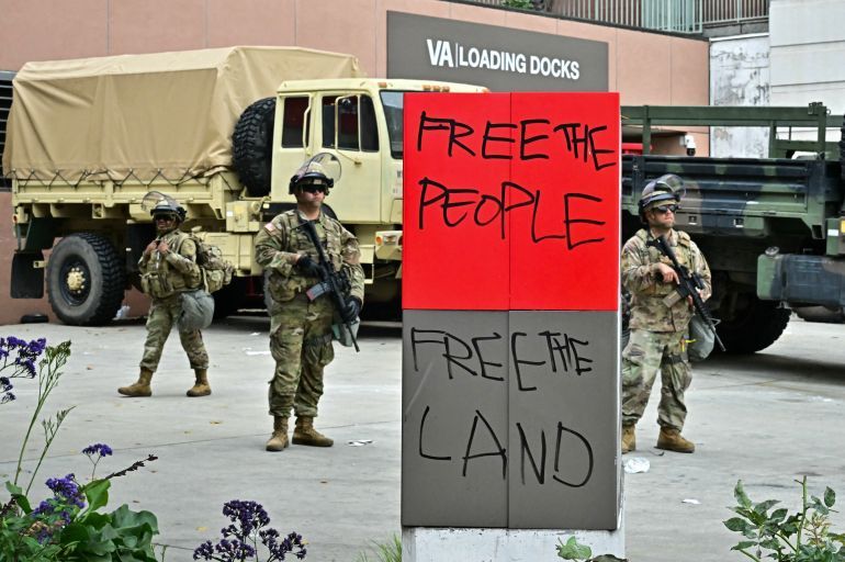 Members of the National Guard stand guard outside the Metropolitan Detention Center, MDC in downtown Los Angeles, California on June 8, 2025.
