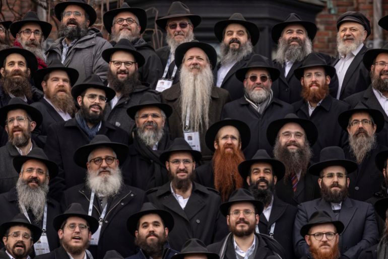 Hasidic Jewish rabbis gather for the annual group portrait outside Chabad-Lubavitch Worldwide Headquarters in the Brooklyn borough of New York, Sunday, Dec. 1 2024. (AP Photo/Yuki Iwamura)