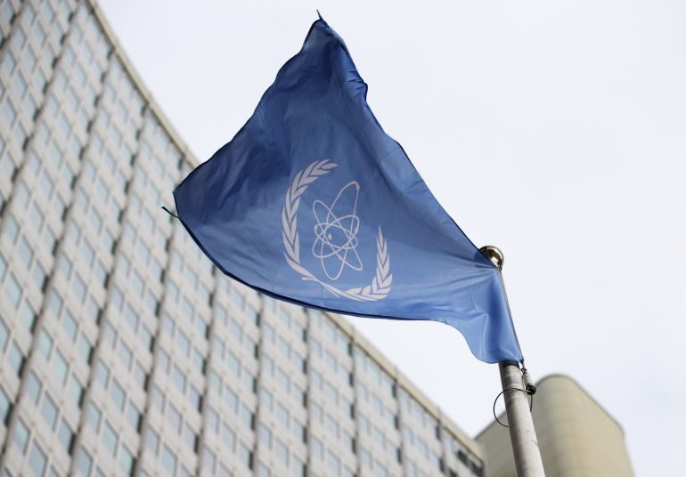 FILE - The flag of the International Atomic Energy Agency flys in front of its headquarters during an IAEA Board of Governors meeting in Vienna, Austria, Feb. 6, 2023. (AP Photo/Heinz-Peter Bader, File)