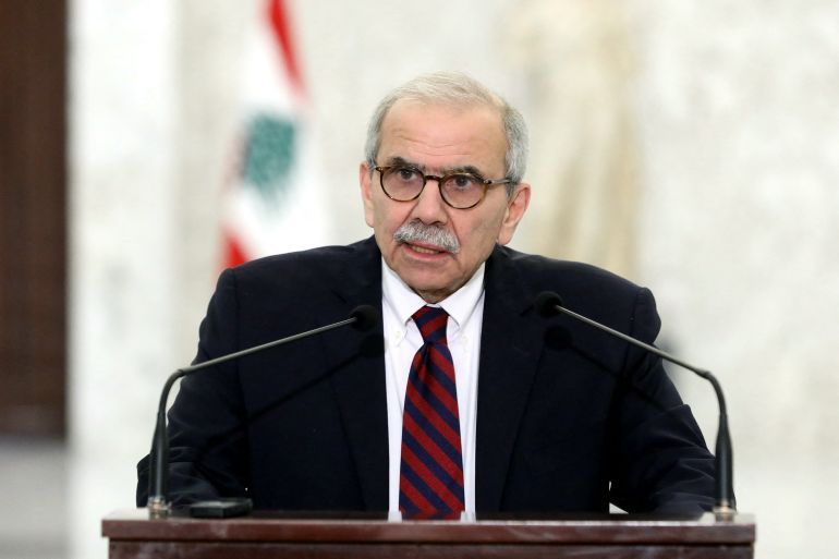This handout picture released by the Lebanese presidency shows designate Prime Minister Nawaf Salam delivering a statement to the press at the presidential palace in Baabda, east of Beirut on February 8, 2025. Lebanon's presidency announced on February 8, that a new government had been formed, ending more than two years of an interim cabinet. President Joseph Aoun signed three decrees, the presidency said in a post on X, one