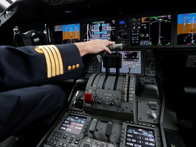An Air France pilot stands in the cockpit of the airline's new Boeing Inc. 787-9 Dreamliner passenger aircraft as it stands on the tarmac at Charles de Gaulle Airport in Roissy, France, December 2, 2016. REUTERS/Benoit Tessier