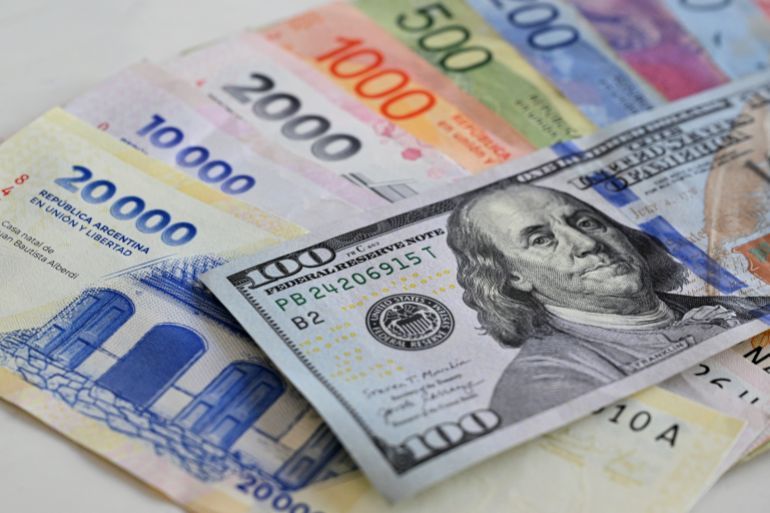 (FILES) This photo illustration shows Argentinian 20,000 pesos, 10,000 pesos, 2,000 pesos, 1,000 pesos, 500 pesos, 200 pesos, 100 pesos and 100 USD banknotes in Buenos Aires on January 13, 2025.