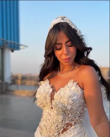 May be an image of 1 person and wedding