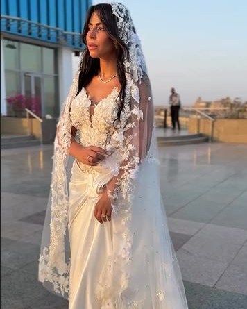 May be an image of 2 people and wedding