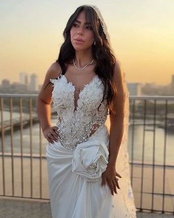 May be an image of 1 person and wedding