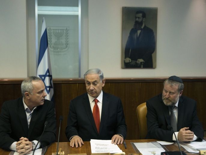 Israel's Strategic Affairs Minister Yuval Steinitz, Prime Minister Benjamin Netanyahu and Cabinet Secretary Avichai Mandelblit (from L to R) attend a weekly cabinet meeting in Jerusalem February 22, 2015.