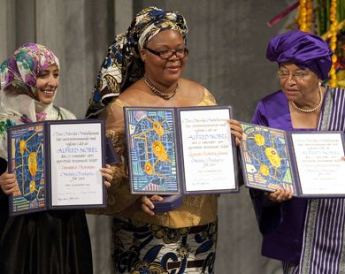 The 2011 Nobel Peace Prize laureates, Liberian President Ellen Johnson Sirleaf (R), Liberian peace activist Leymah Gbowee (C) and Yemeni activist Tawakkol Karman (L) pose on December 10, 2011 with their medals and certificates during the Nobel Peace Prize award ceremony at the City Hall in Oslo.