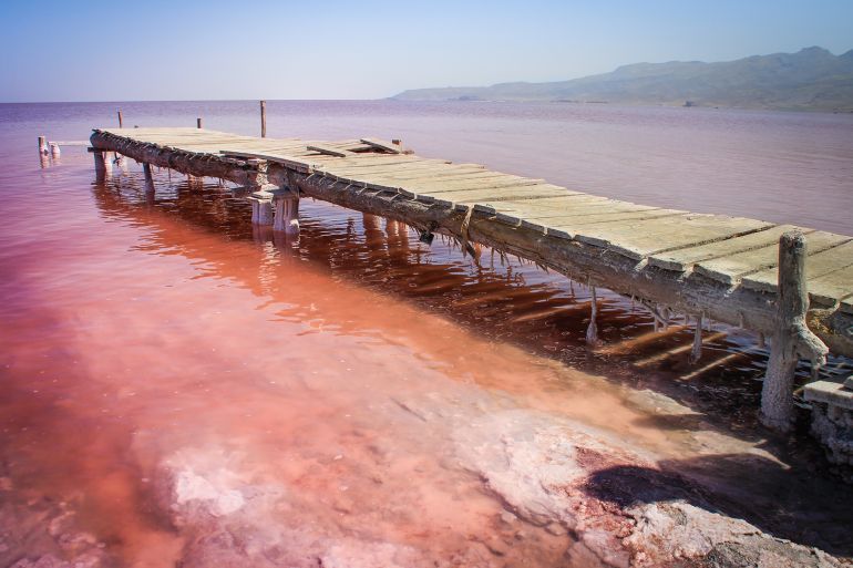 The unusual pink Lake Urmia, full of salt and a picturesque bridge