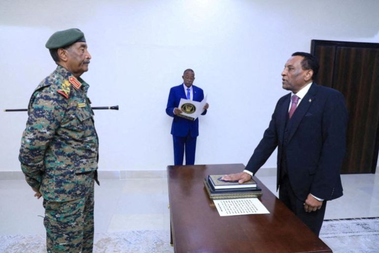 Sudan army chief, Abdel Fattah al-Burhan attends former UN official Kamil Idris swearing-in ceremony, as Sudan's new prime minister, in Port Sudan, Sudan, May 31, 2025. Sudan Transitional Sovereignty Council/Handout via REUTERS THIS IMAGE HAS BEEN SUPPLIED BY A THIRD PARTY. TPX IMAGES OF THE DAY