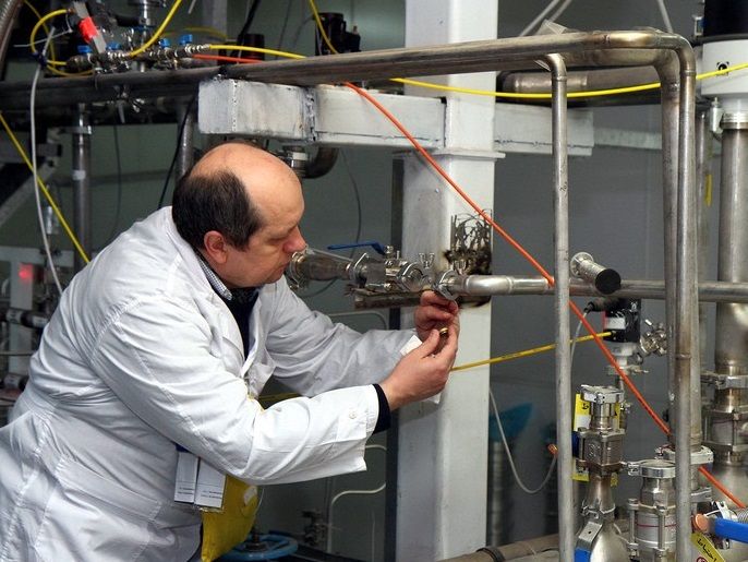 epa04032751 An IAEA inspector checks the enrichment process inside the uranium enrichment plant Natanz in central Iran on 20 January 2014. The aim of the inspectors was to check whether Iran would fulfill its commitments in line with the Geneva agreement of November 24 last year and suspend uranium enrichment at 20 per cent. This was one of the main conditions for the European Union to ease parts of the economic sanctions imposed on Iran due to the decade-long nuclear d