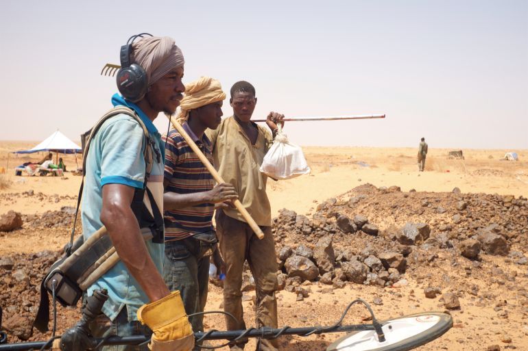 Akjoujt, Mauritania - September 8, 2016: artisanal miners looking for gold nuggets with metal detectors in the Mauritanian desert. 2016 was the start of a gold rush frenzy in Mauritania.