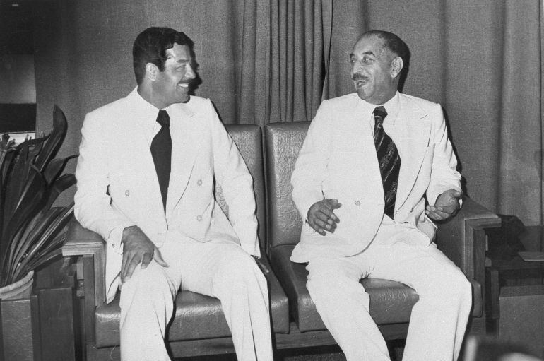 President Ahmed Hassan al-Bakr of Iraq, right, and Saddam Hussein, vice president and chairman of the Baath Socialist Party ruling Iraq, share a light moment at the Baghdad Summit, Nov. 1978. Saddam Hussein is a 