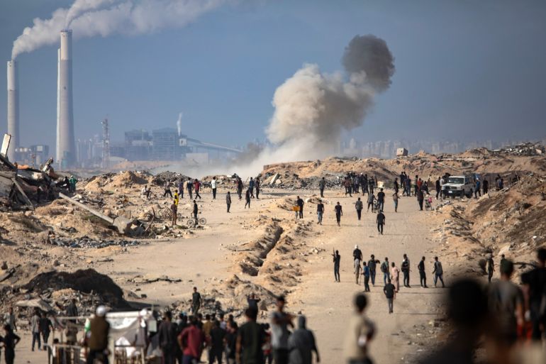 epa12197283 Smoke rises after an artillery shell fired by an Israeli tank towards aid seekers in the Zikim area, west of Gaza City, 25 June 2025. EPA/HAITHAM IMAD