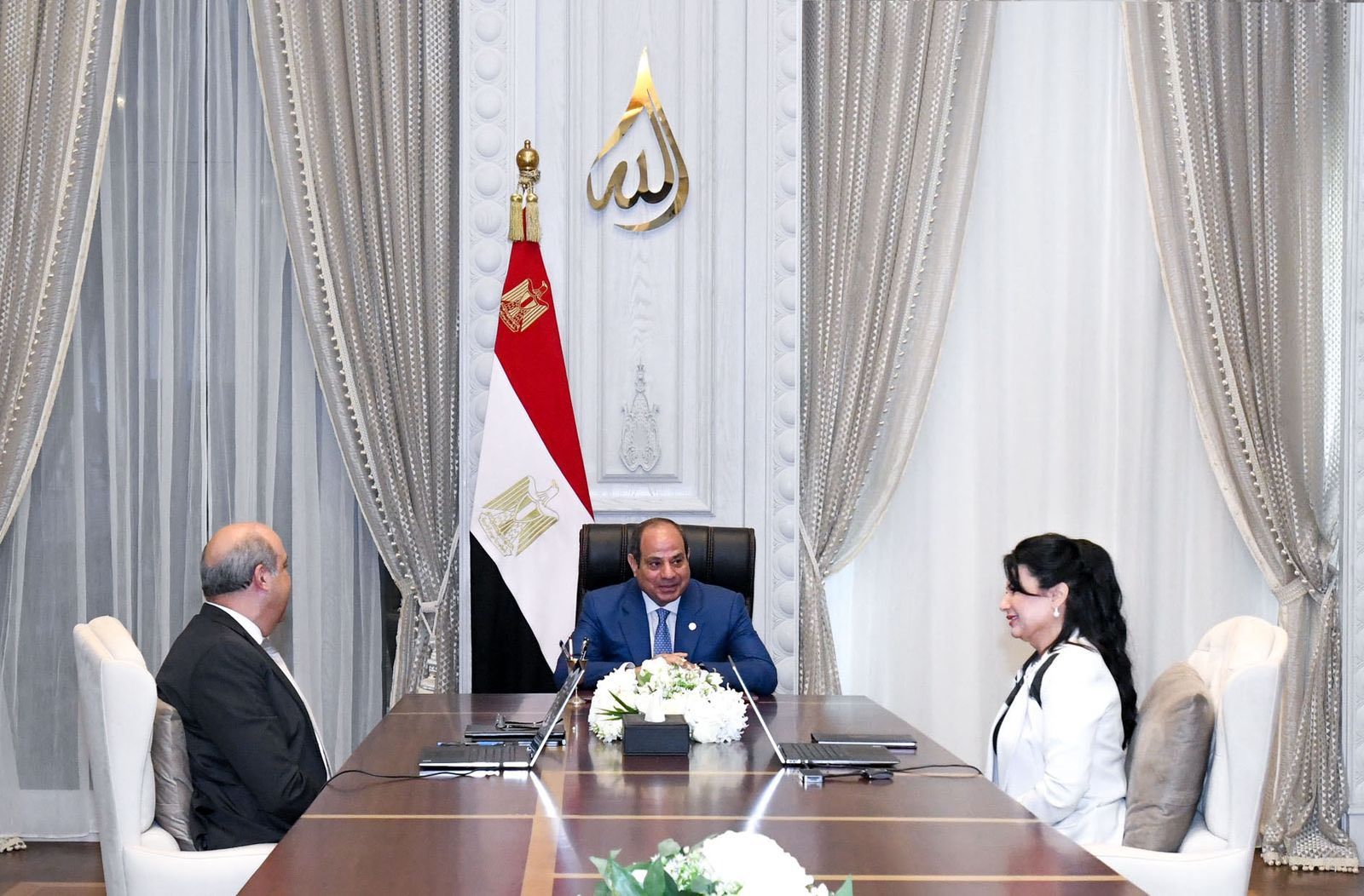 May be an image of 3 people, the Oval Office, dais and text