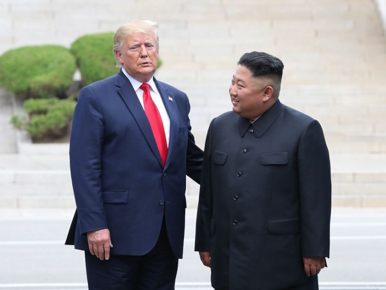 epa07683953 US President Donald J. Trump (L) talks with North Korean leader Kim Jong-un after crossing the Military Demarcation Line into the North's side at the truce village of Panmunjom in the Demilitarized Zone, which separates the two Koreas, 30 June 2019. The US leader arrived in South Korean on 29 June for a two-day visit that will include a meeting with South Korean President Moon Jae-in and a trip to the Demilitarized Zone. EPA-EFE/YONHAP SOUTH KOREA OUT