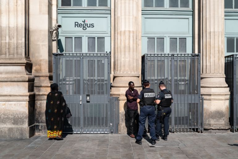 Police officers check young men's identity in downtown Marseille, southern France, on March 21, 2024, two days after the visit of French President, focused on security and drug trafficking. Emmanuel Macron launched on March 19, 2024 a major operation against drug trafficking in Marseille and other French cities, saying that gangland battles that last year left dozens dead had made life a misery for residents. (Photo by Nicolas TUCAT / AFP)