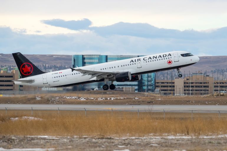Calgary, Alberta, Canada. December 31, 2023. An Air Canada Airbus A321-211 with identification C-FGKZ taking off from Calgary International Airport