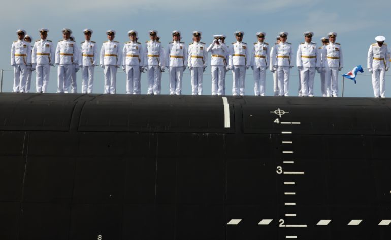 SEVEDOVDINSK, RUSSIA - JULY 24: (RUSSIA OUT) Russian naval officers of the Knyaz Pozharsky nuclear submarine's crew await for President Putin at the Sevmash Shipbuilding Plant, July 24, 2025, in Severodvinsk, Arkhangelsk oblast, Russia. Putin visited Russia's main military shipbuilding plant, marking the upcoming the Day of Russian Navy. (Photo by Contributor/Getty Images)