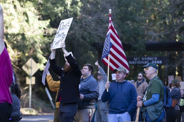 Protesters gather at Washington's Mount Rainier National Park in a rally to save public lands and in support of employees of federal land management agencies on Saturday, March 1, 2025. A group calling themselves the Resistance Rangers organized the nationwide