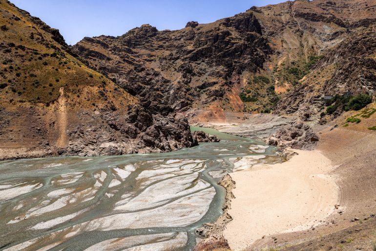 The low water inlet of the river upstream of the Amir Kabir dam along the Karaj river is pictured in Iran's northern Alborz mountain range on June 1, 2025. Tehran is facing a water shortage due to low rainfall last year and the beginning of summer. (Photo by ATTA KENARE / AFP)